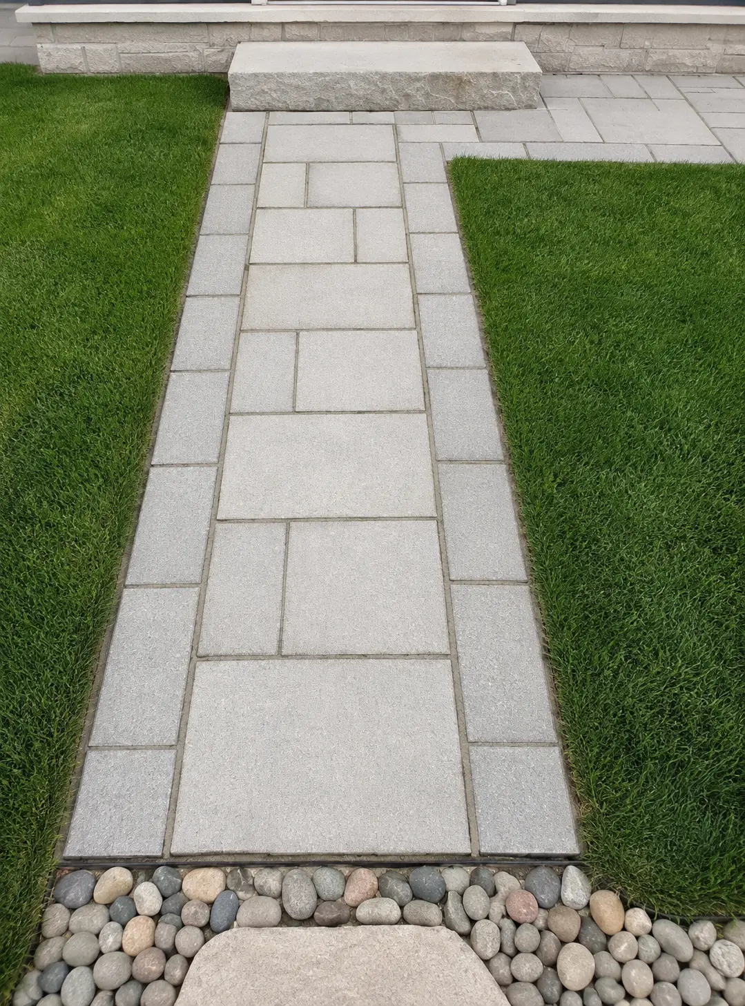 Granite Paver Walkway with River Rock Border