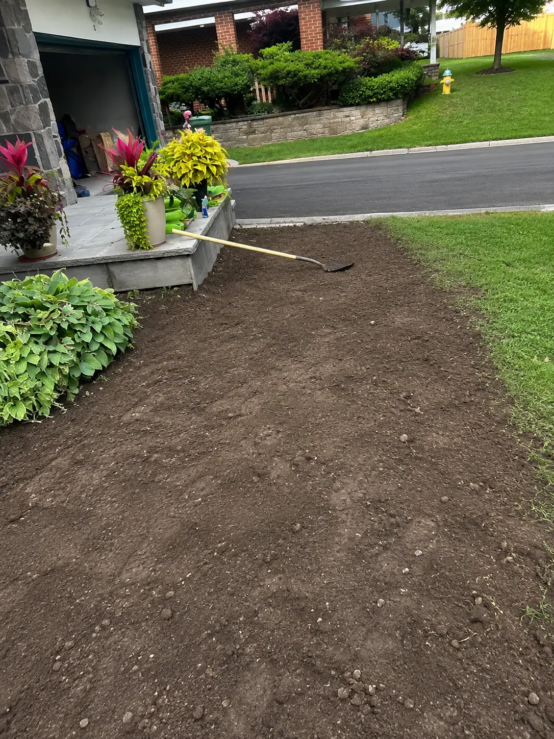 Grading topsoil for a new front lawn